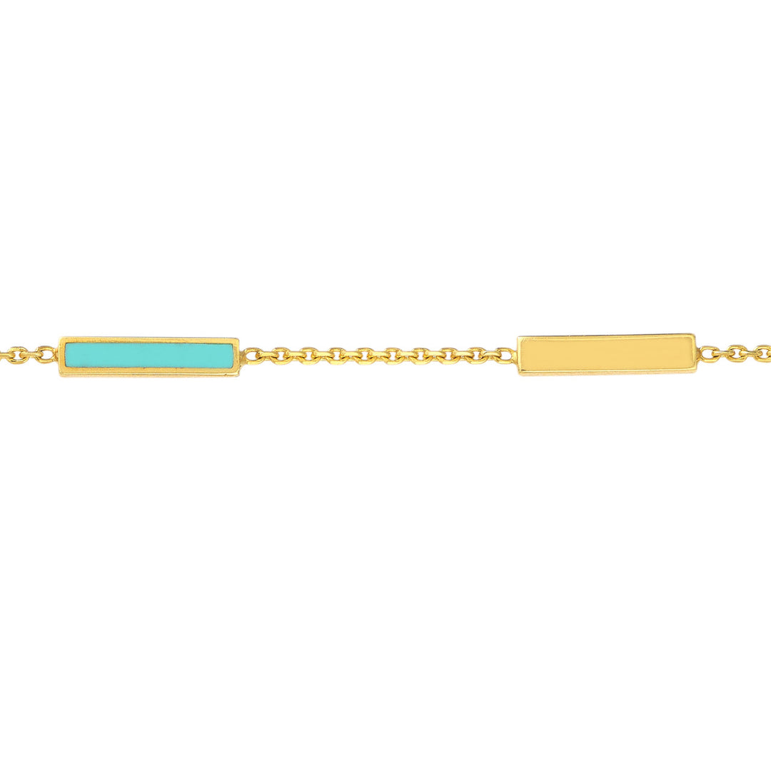 close up of the turquoise enamel bar and alternating gold bar charms on a bracelet chain