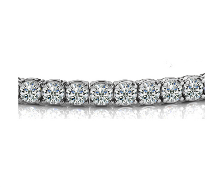 close up of the Small Four Prong Diamond Tennis Bracelet'd diamonds on white gold