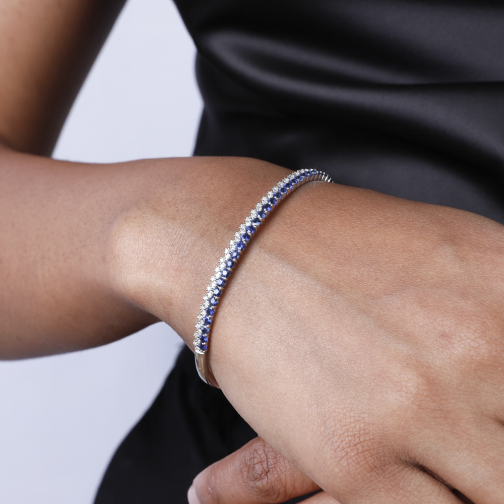 Two Tone Stone & Diamond Bangle close up on a womans wrist