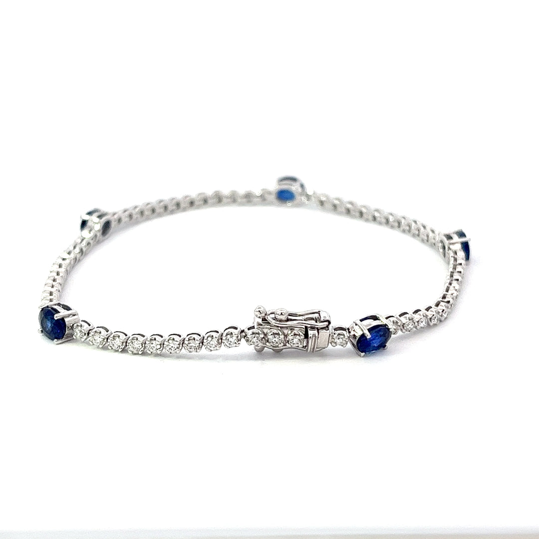 close-up of the diamond tennis bracelet with sapphires with the clasp
