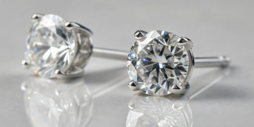 1 carat natural diamond stud earrings in a white gold setting.