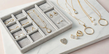 The best fine jewelry for Mother's Day, featuring gold necklaces, pearl earrings, and diamond pieces.