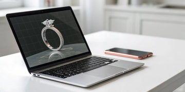 A custom 3D ring design being created on a laptop with a free online design tool.