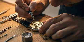 A watchmaker uses precision tools to perform the best watch repair in NYC.