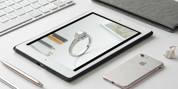 A custom ring being designed on a tablet with a design your own ring app.