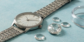 A watch with replacement glass options, showing the cost of the repair.