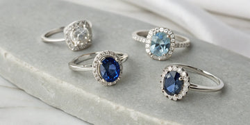 Bespoke sapphire engagement rings with diamond halos in various cuts and settings.