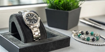 A certified pre-owned Rolex watch in its display box.