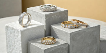 A variety of diamond wedding bands for women in white and yellow gold.