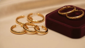 Gold hoop earrings arranged for a jewelry style consultation