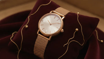 Gucci timepieces buying guide featuring a luxury designer wristwatch on burgundy velvet