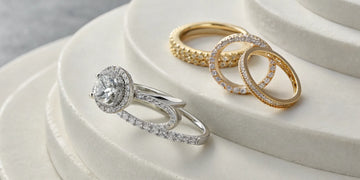 Curved wedding band creating a seamless fit with a halo engagement ring.