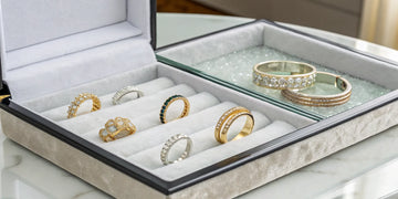 A collection of gold and diamond anniversary bands in different styles and metals.
