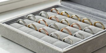 Various styles of diamond engagement bands in gold, rose gold, and platinum.