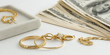 Selling gold jewelry and rings for a pile of cash.