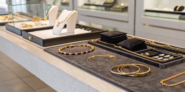 A display of gold bracelets on a counter, ready to be sold to a local jeweler.