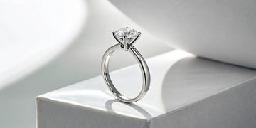 A modern and delicate 1.5 mm solitaire diamond engagement ring.