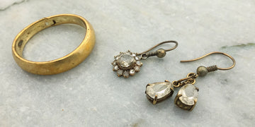 A before and after jewelry redesign of a gold ring and diamond earrings.