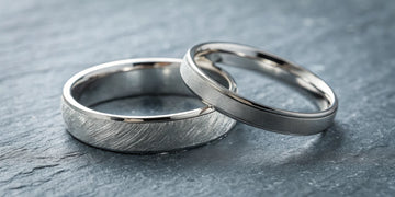 Platinum rings with different finishes showing the patina from daily wear.
