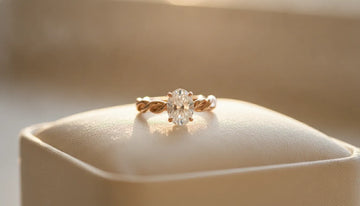 Rose gold engagement ring with a twisted band