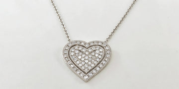 Sparkling diamond heart pave necklace on a delicate white gold chain.