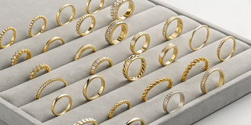 An assortment of popular gold rings in different styles, from minimalist to bold designs.