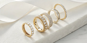 A variety of gold anniversary bands for her, including diamond eternity rings and simple bands.