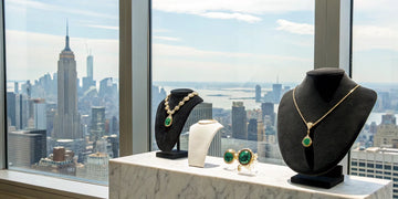 A custom jewelry piece on display with the New York skyline in the background.