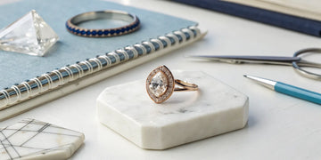 A unique custom-designed engagement ring with a halo diamond.