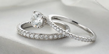 14k white gold engagement ring and wedding band bridal set with round diamonds.