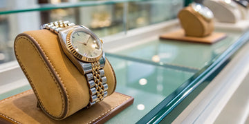 A Rolex watch in a display case at an authorized Long Island, NY retailer.