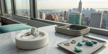 A selection of bespoke engagement rings and gemstones overlooking New York City.