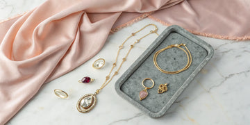 Luxury personalized jewelry for mom, including gold rings, necklaces, and bracelets.