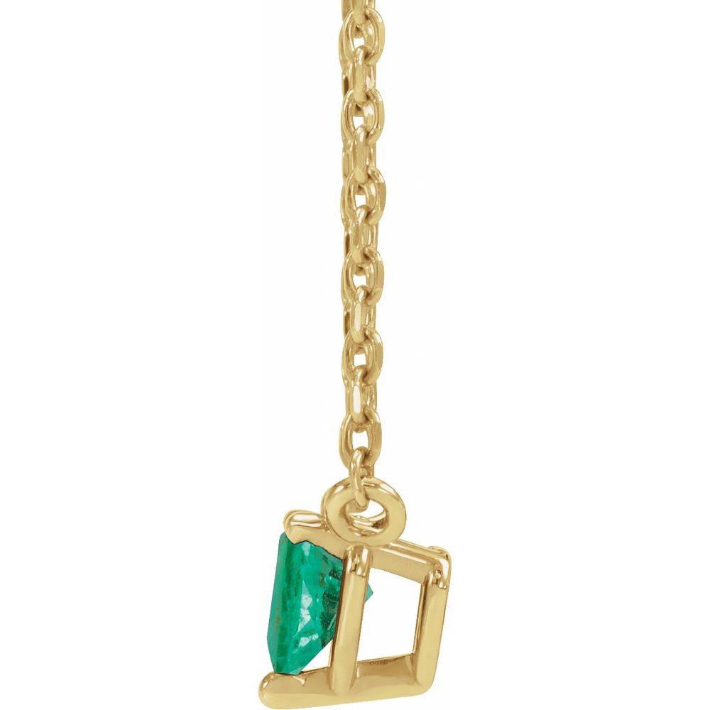 Side profile view of our emerald heart necklace