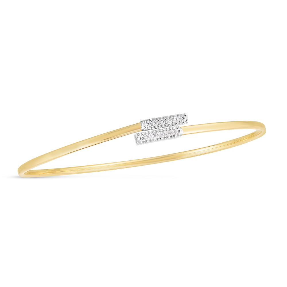 Indulge in the luxurious sophistication of our Diamond Bypass Bar Bangle in 14K Gold . Crafted with elegance and adorned with exquisite diamonds, this bangle exudes a sense of exclusivity and opulence.