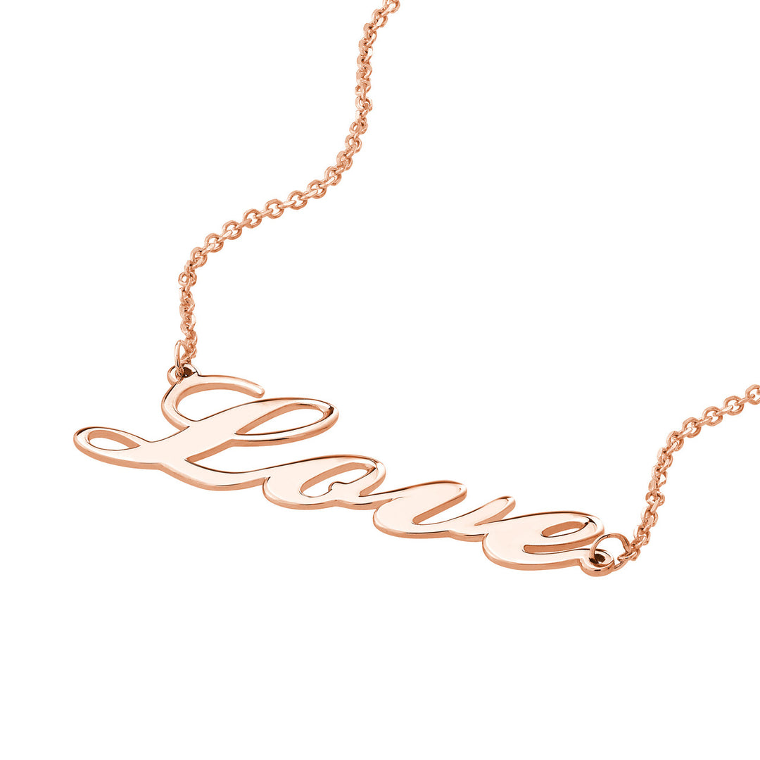 close-up of the text "love" charm in rose gold