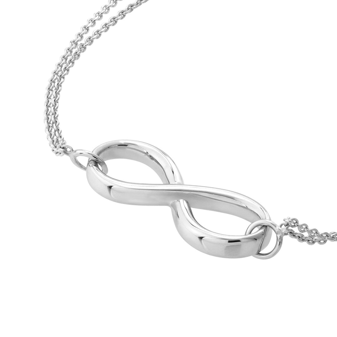 close up of the infinity bracelet charm in white gold