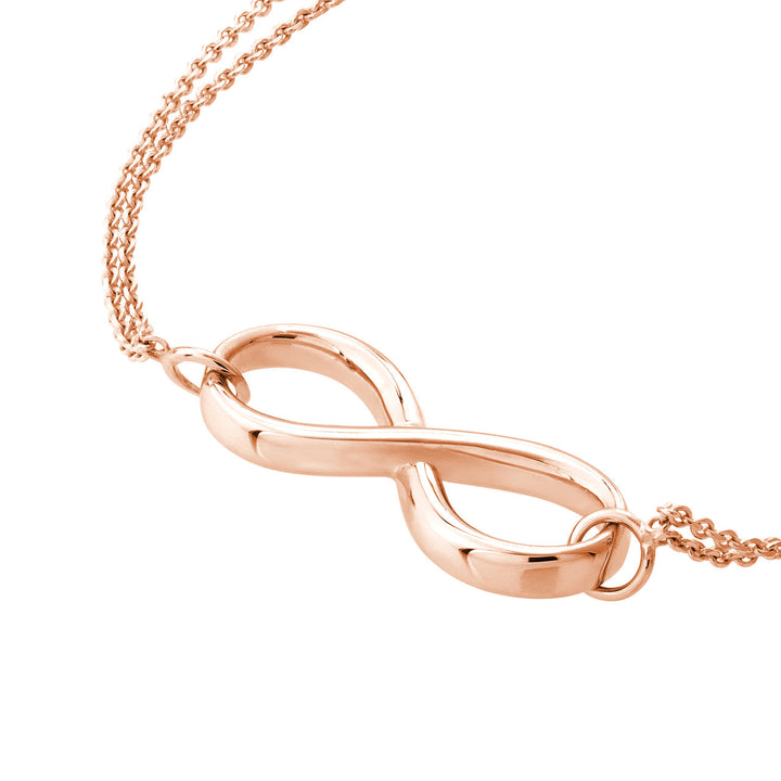 close up of the infinity symbol charm in rose gold