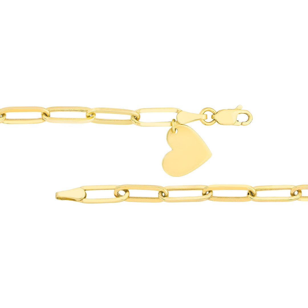 close up of dangle heart charm and bracelet clasp in yellow gold