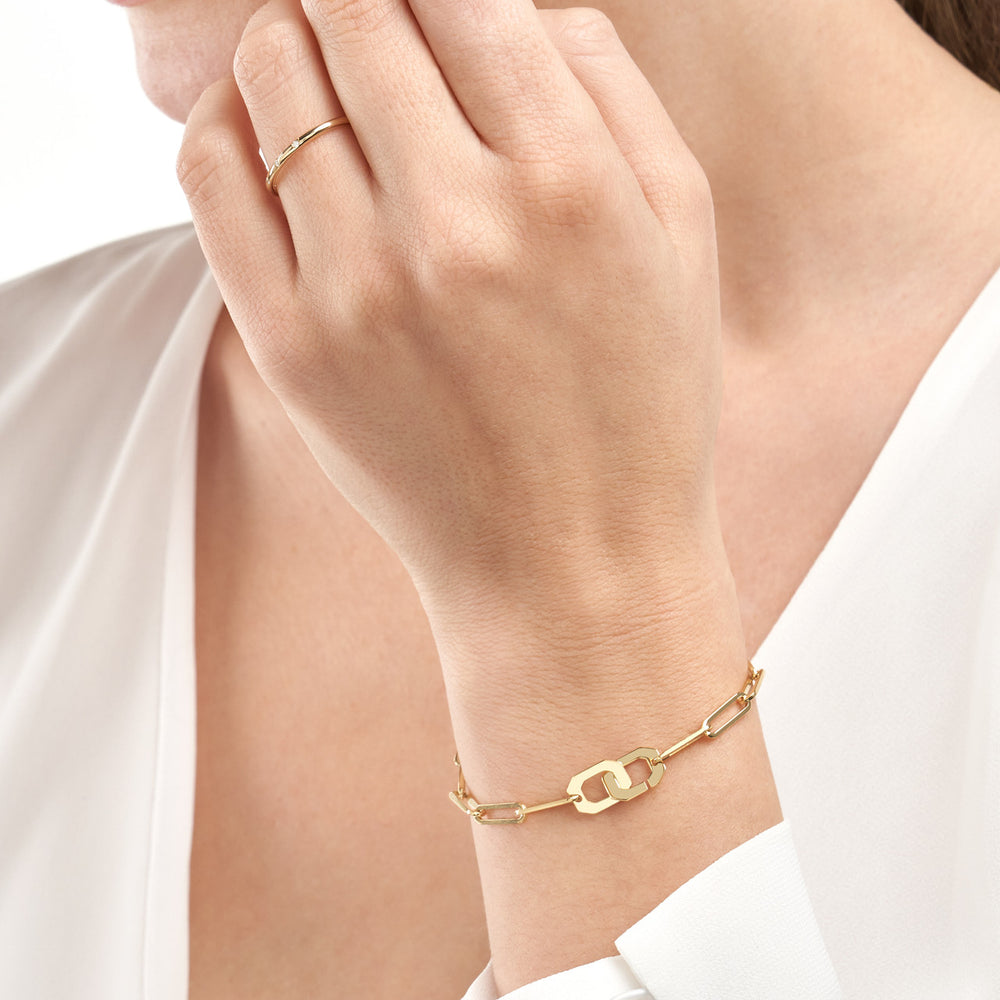 woman modeling the Octagon Clasp Paper Clip Bracelet on her wrist