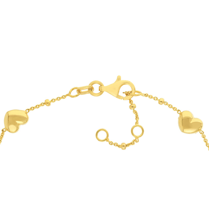 close up of the adjustable sizing clasp in yellow gold