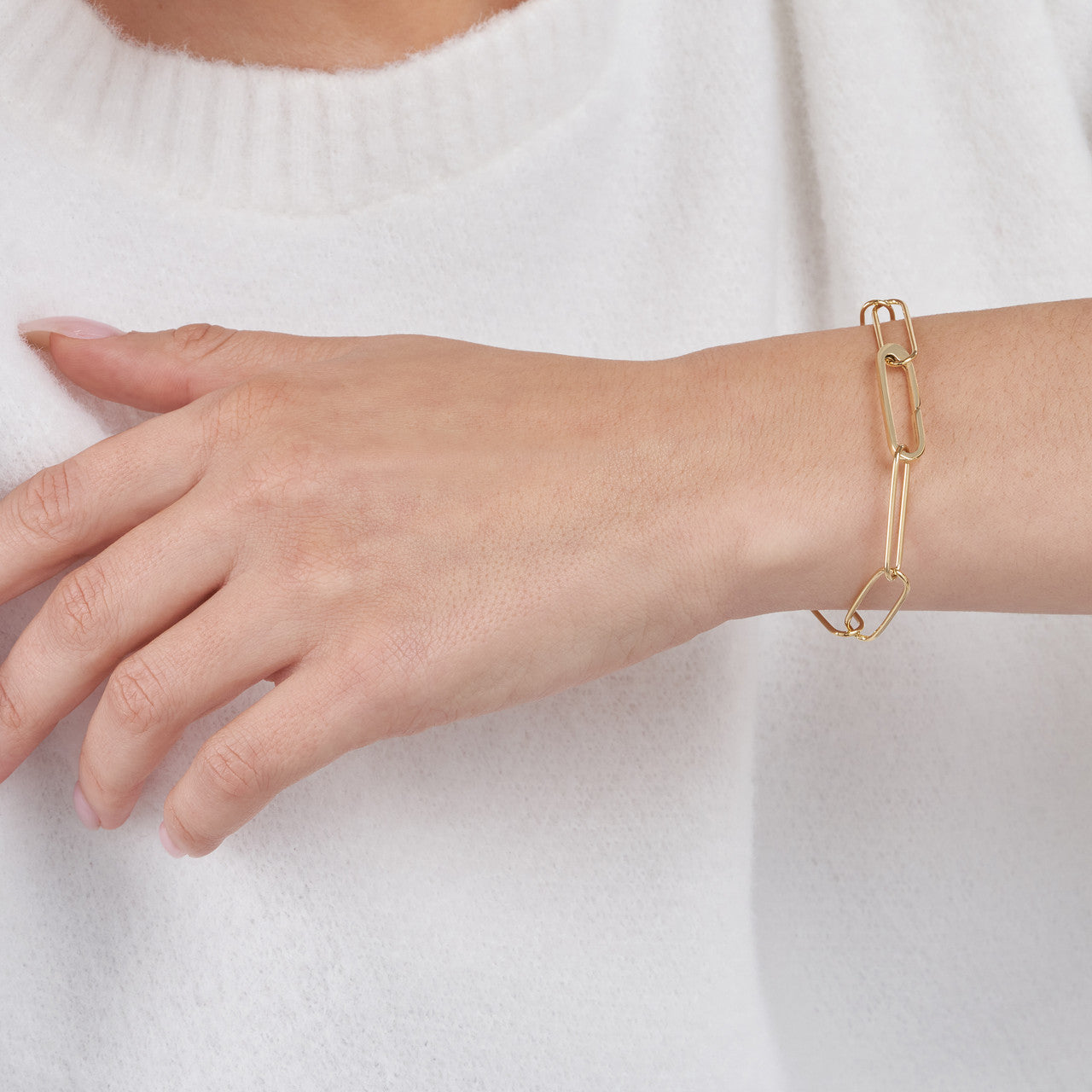 woman wearing the Push Lock Paper Clip Bracelet on her wrist