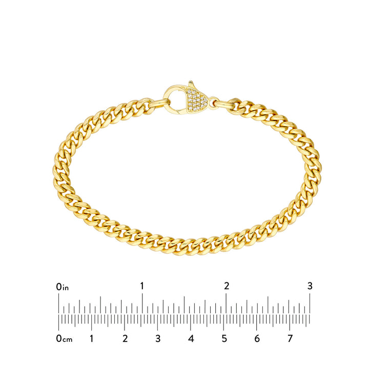 Pave Diamond Pear Lock Curb Chain Bracelet next to a 3in ruler for sizing comparison