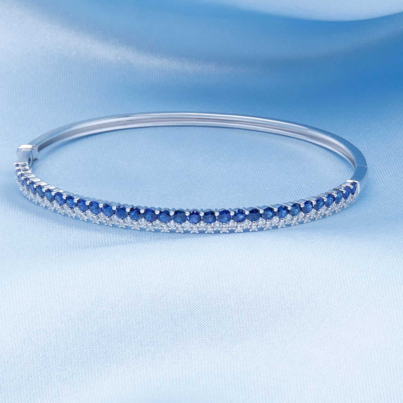 Two Tone Stone & Diamond Bangle with blue gem stones