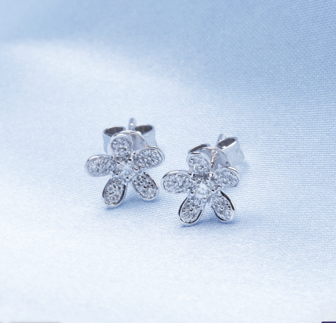 Radiate beauty with our Diamond Flower Studs in 14K white gold, featuring a stunning center diamond stone. Shop now for a touch of elegance!"