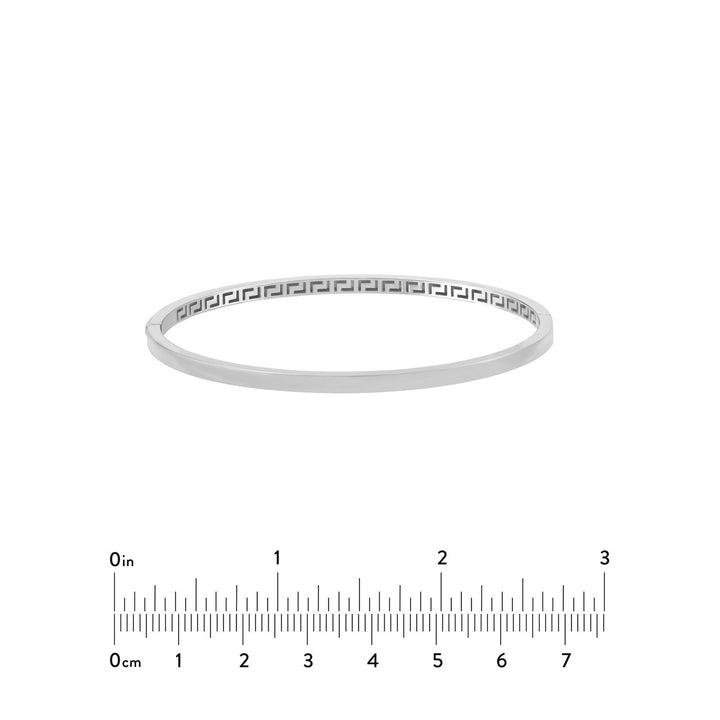 Plain Square Tube Bangle in white gold next to a 3in ruler