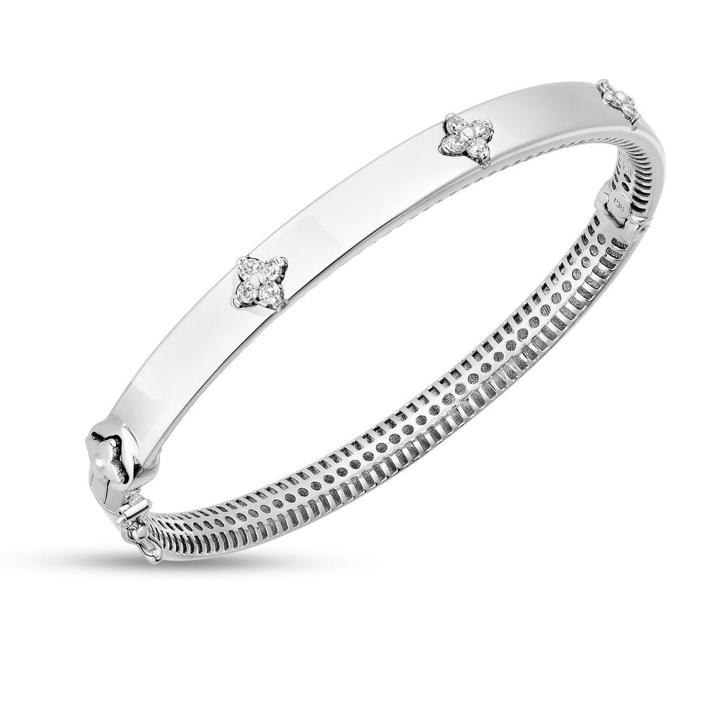 Trilogy Diamond Bangle in white gold at an angle so you can see the inside of the bracelet